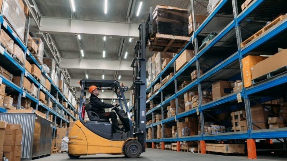 A forklift works in a warehouse.