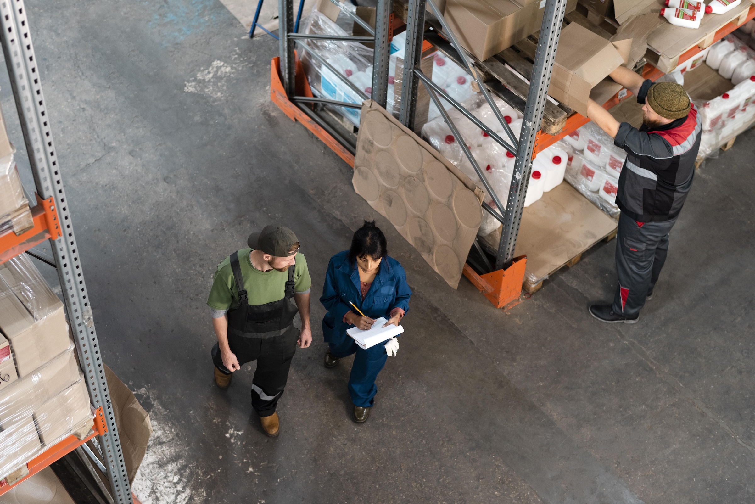 three people working in a warehouse